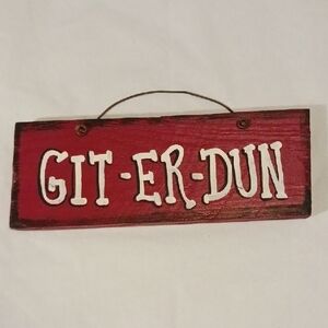 Red Wooden Sign with White Text